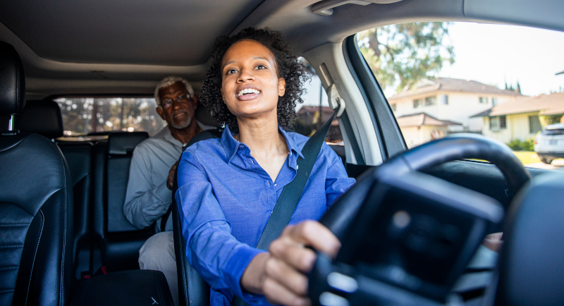 NEMT driver assisting passenger